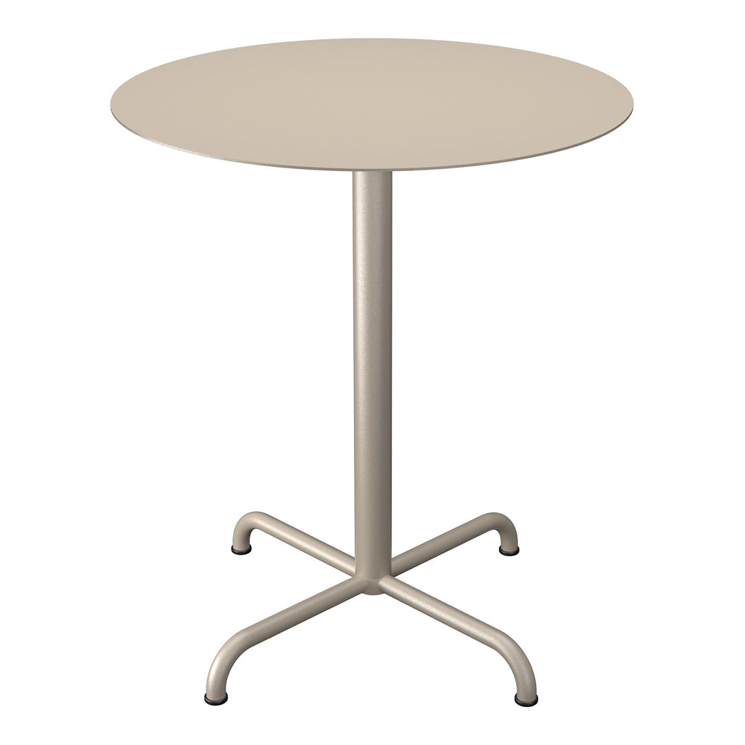 Round beige table with a smooth surface and a minimalist design, featuring a sleek metal base and four sturdy legs.