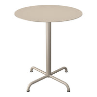 Round beige table with a smooth surface and a minimalist design, featuring a sleek metal base and four sturdy legs.
