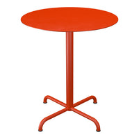 Round red dining table with a sleek, modern design and a minimalist flat surface. Perfect for outdoor or indoor use.