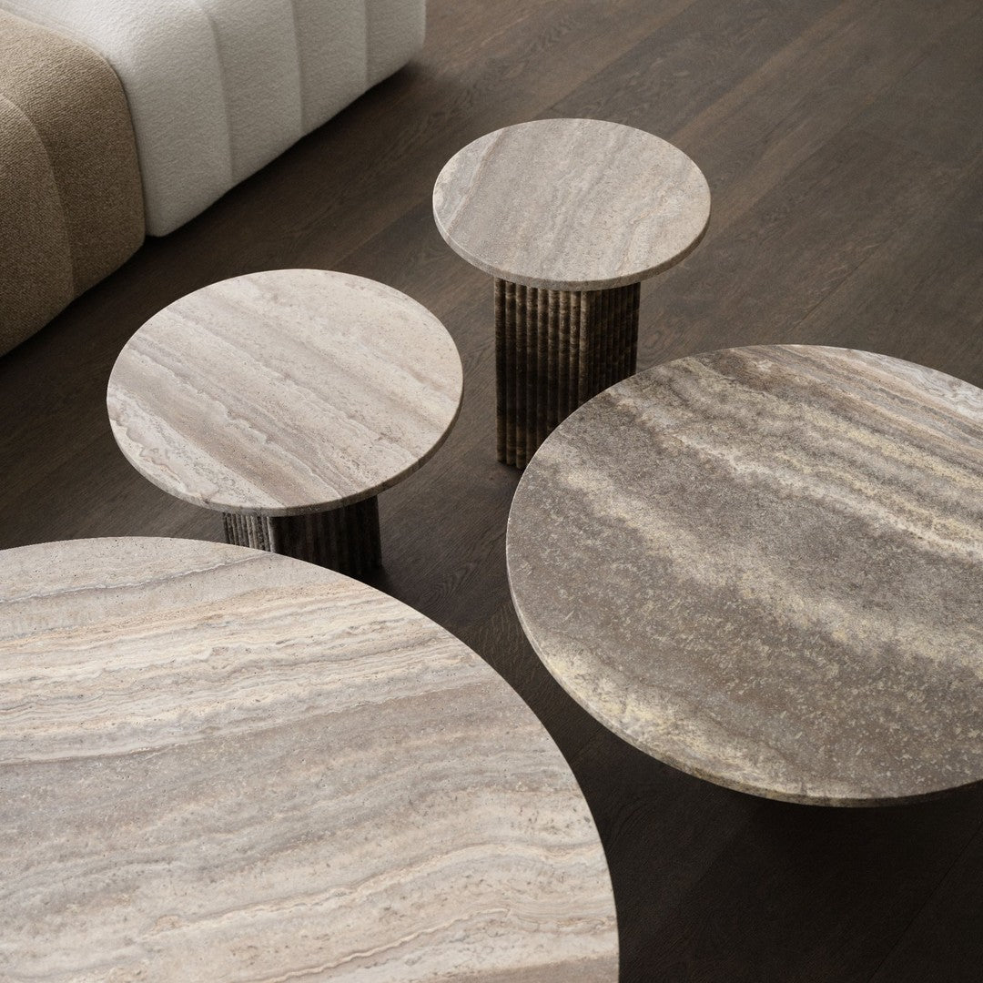 Set of round marble tables featuring earthy tones and subtle veining patterns, ideal for modern home decor.
