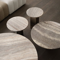 Set of round marble tables featuring earthy tones and subtle veining patterns, ideal for modern home decor.