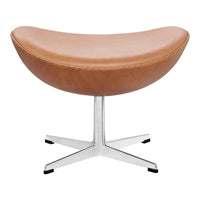 Brown leather curved stool with a sleek chrome base, showcasing a modern minimalist design.