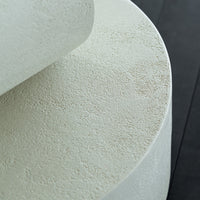 Light beige textured surface with subtle variations, set against a dark background. Perfect for modern decor.