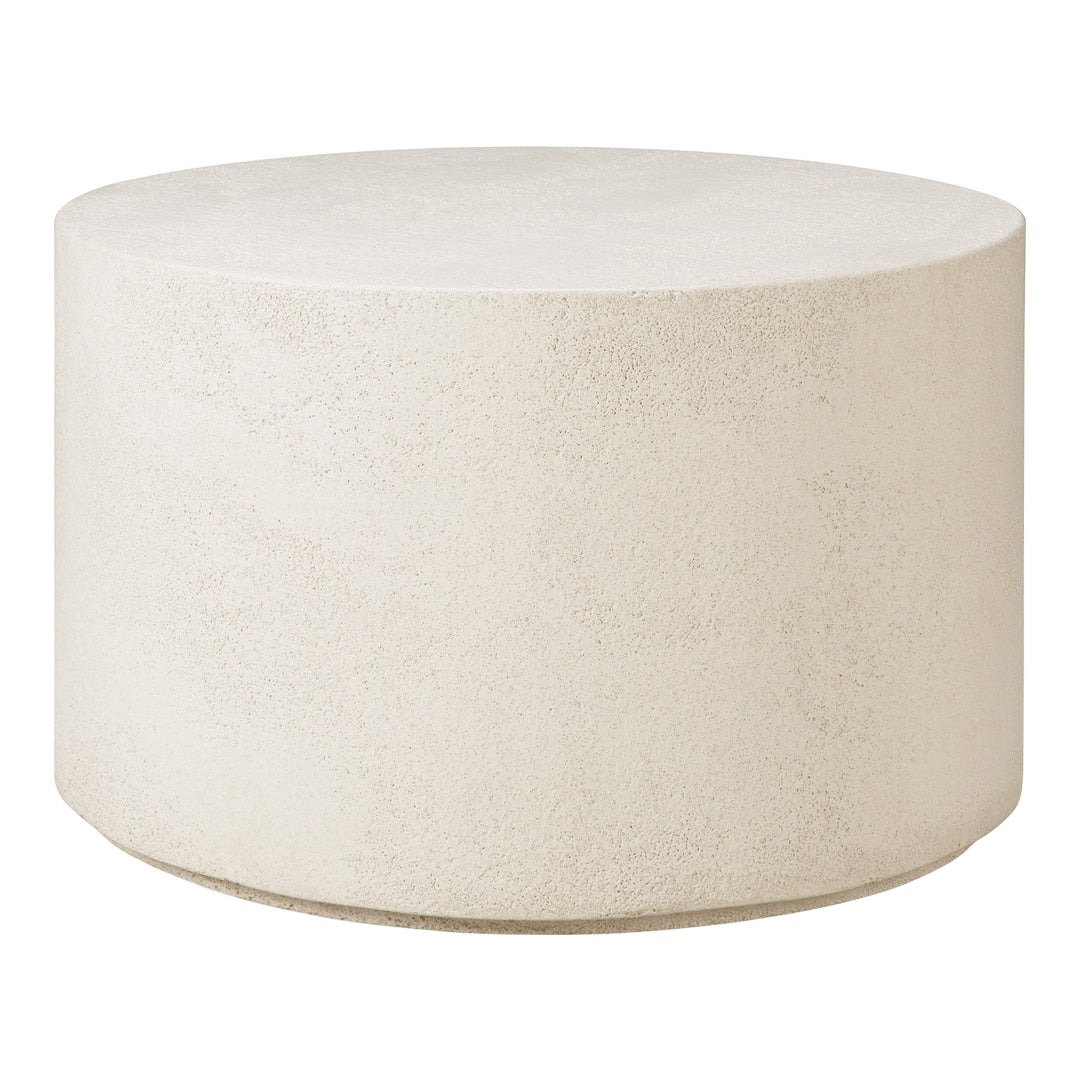 Round concrete coffee table in a soft off-white finish with a smooth, matte texture.