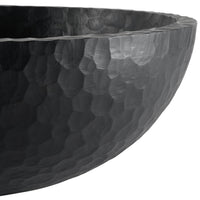 Black hammered bowl with a glossy finish, featuring a unique textured pattern and sleek, modern design.