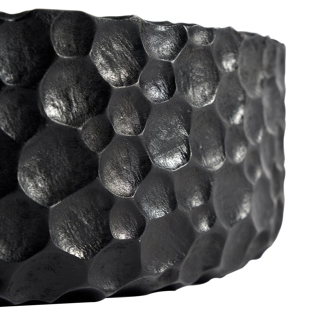 Black honeycomb-patterned bowl with a textured, matte finish. Perfect for modern decor.