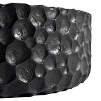 Black honeycomb-patterned bowl with a textured, matte finish. Perfect for modern decor.