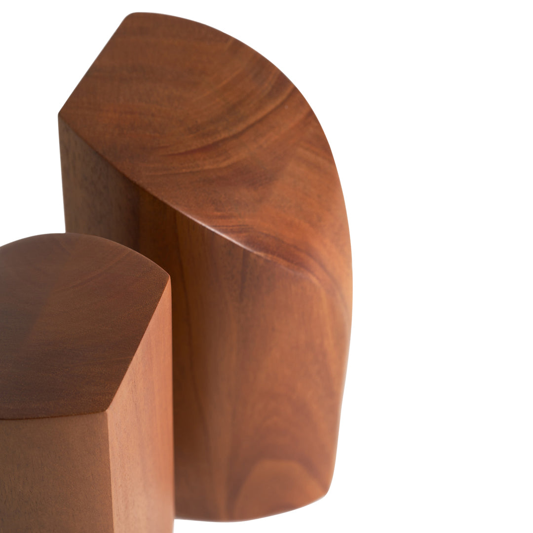 Brown wooden geometric decor with smooth, polished surfaces and curved edges, showcasing rich wood grain patterns.