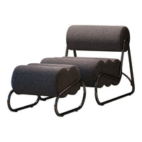 Gray upholstered chair with rounded shapes and sleek black metal legs. Modern design with a minimalist aesthetic.