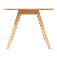Light natural wood table with a smooth finish and minimalist design, featuring clean lines and no visible patterns.