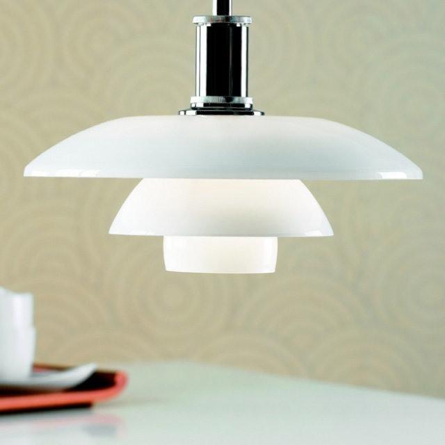White glass pendant lamp with layered shades and a sleek chrome finish, showcasing a modern minimalist design.