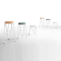 Colorful modern bar stools in shades of orange, teal, white, and light gray with minimalistic white legs.