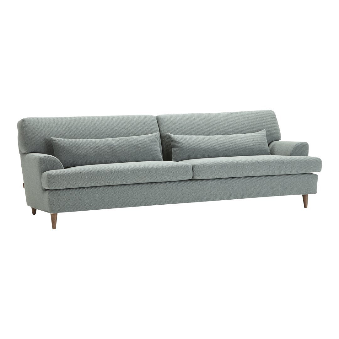 Light blue upholstered sofa with a smooth texture and wooden legs, featuring minimalist design and clean lines.
