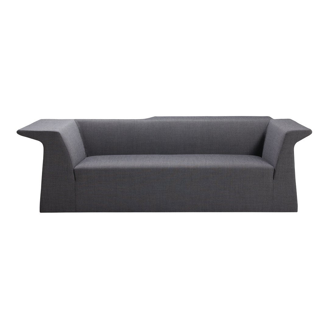 Modern dark gray sofa with sleek lines and minimal pattern, perfect for contemporary living spaces.
