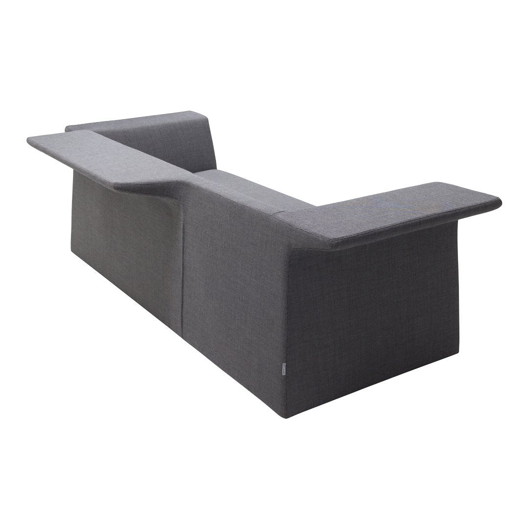 Modern grey sofa with a sleek, geometric design and minimalistic pattern, perfect for contemporary interiors.