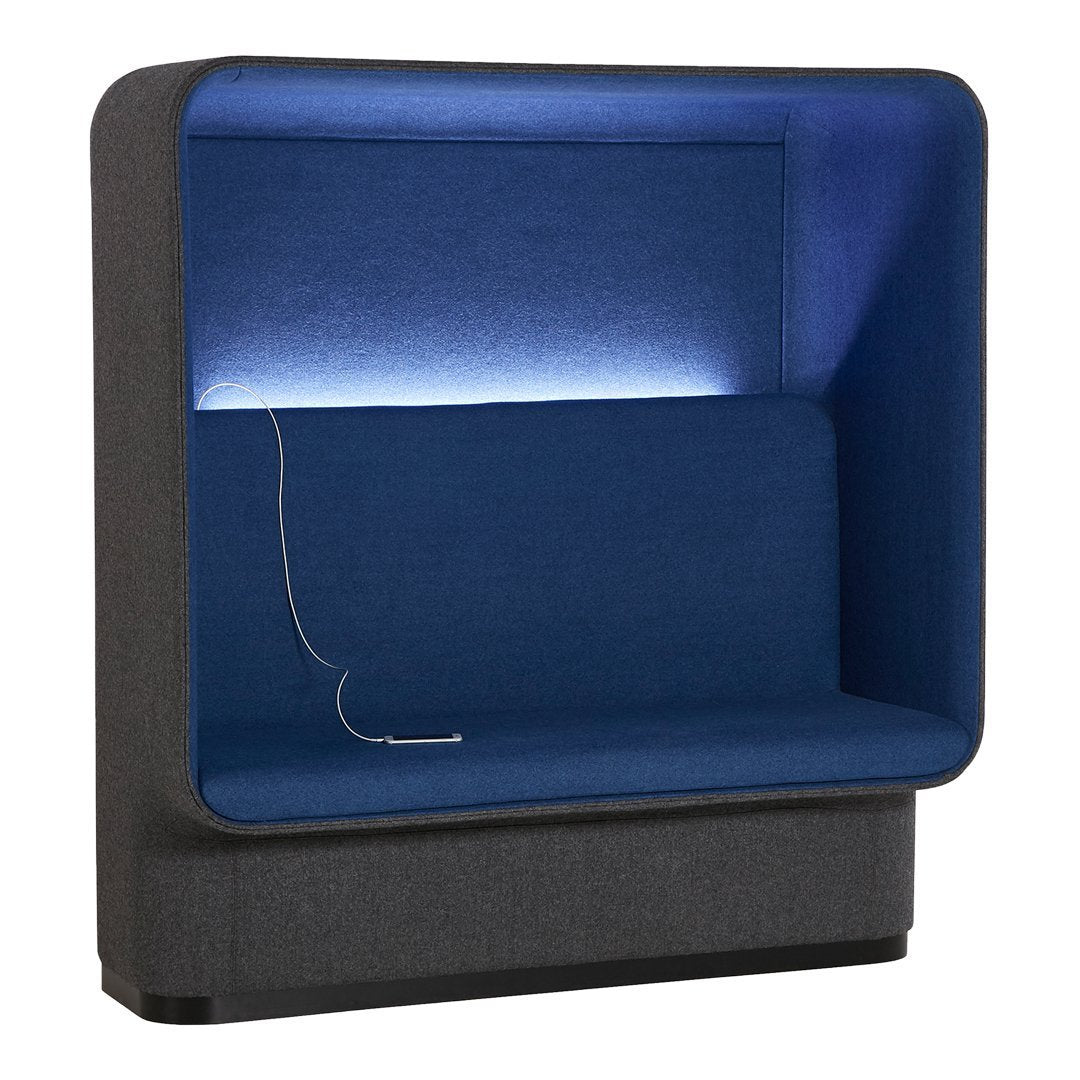 Modern seating booth in dark gray with a vibrant blue interior and soft LED lighting. Stylish and cozy design.