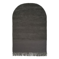 Gray plush towel with a solid dark gray bottom and fringed edges. Smooth texture and elegant arch shape.
