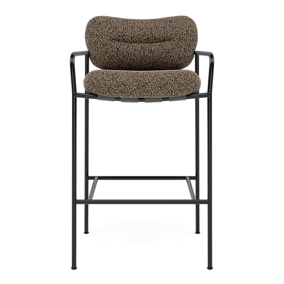Patterned brown fabric with a textured design on a sleek black metal frame bar stool.