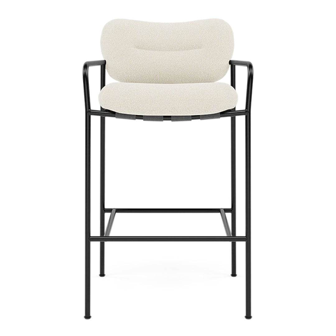 Cream upholstered bar stool with a sleek black metal frame, featuring a smooth, minimalist design.