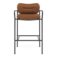Brown upholstered bar stool with a smooth, rounded seat and sleek black metal frame. Perfect for modern decor.