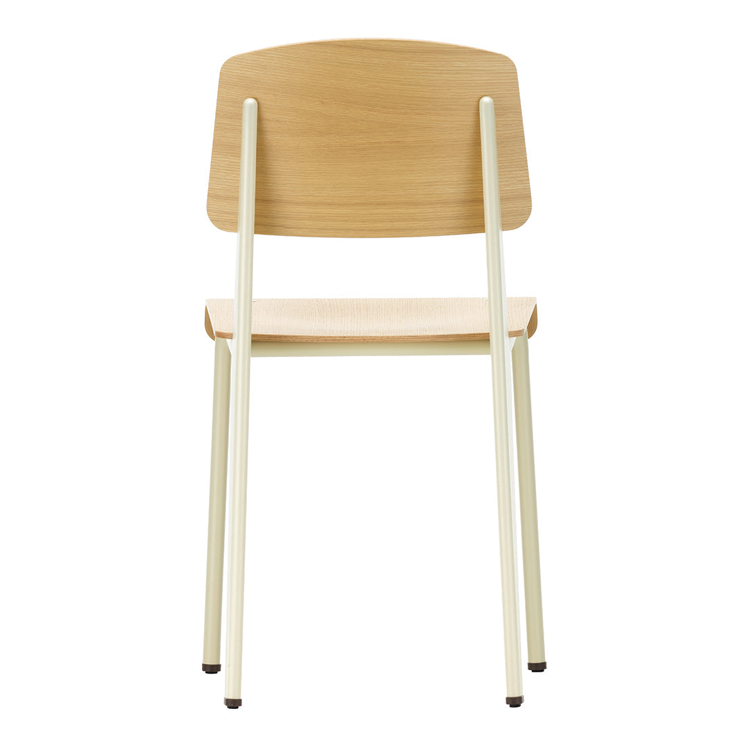 Light wood chair with a minimalist design, featuring a natural wood finish and soft cream legs.