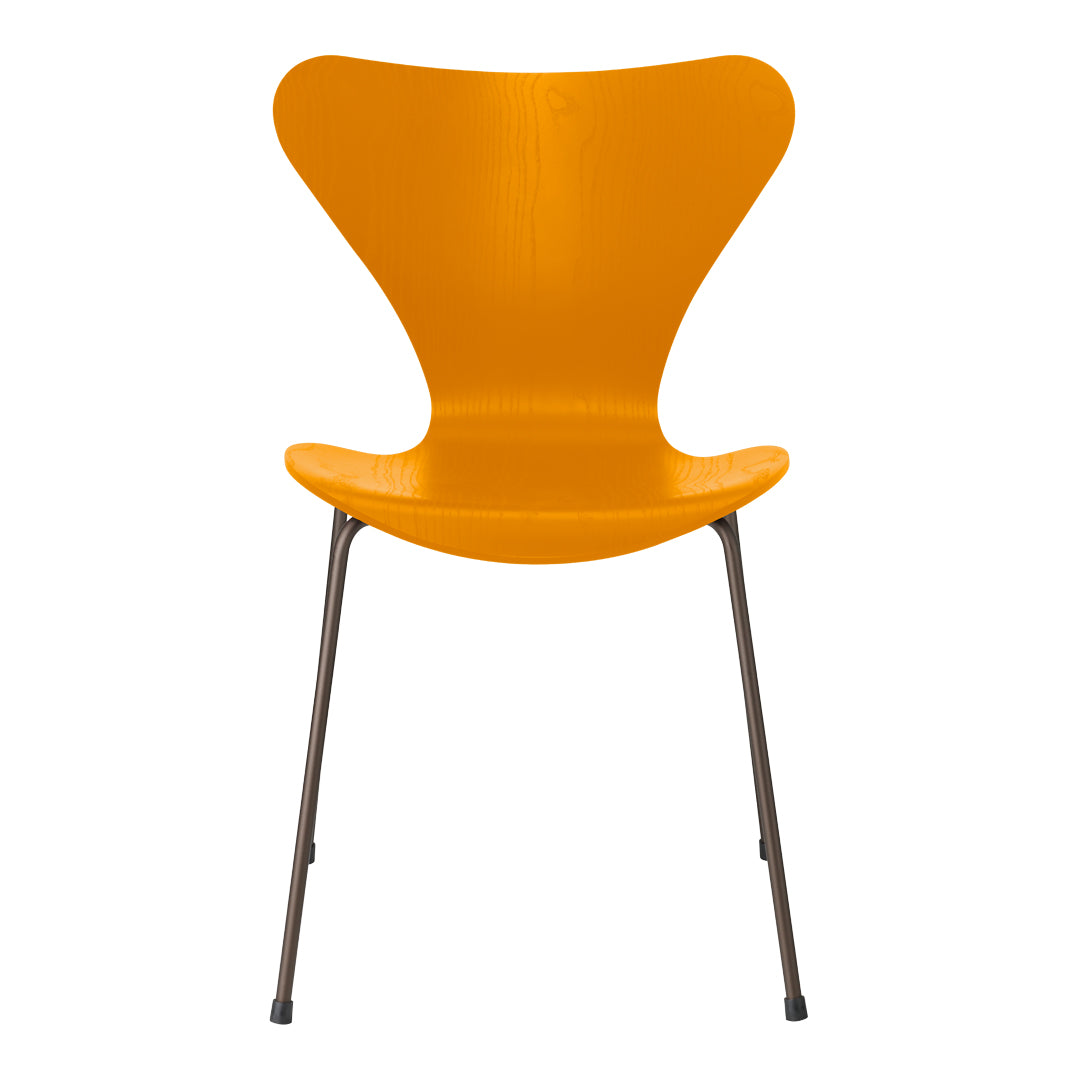 Bright orange chair with a sleek, modern design and a smooth, curved backrest. Perfect for vibrant decor.