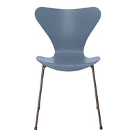 Gray modern chair with a unique butterfly shape and sleek metal legs, perfect for contemporary decor.