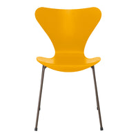 Bright yellow chair with a modern, butterfly-shaped design and sleek metal legs. Perfect for adding a pop of color.