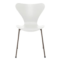 White chair with a distinctive butterfly shape and sleek brown legs, perfect for modern decor.
