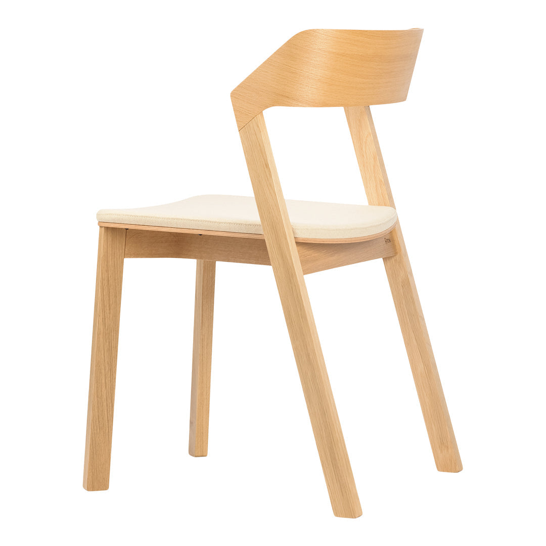 Natural wood chair with a light beige seat, showcasing a minimalist design and sleek lines. Perfect for modern decor.
