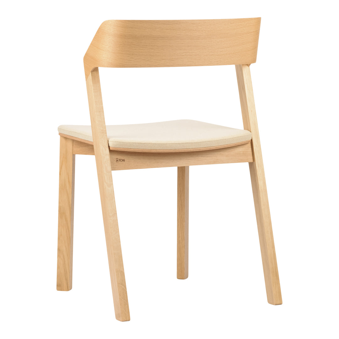 Light wood chair with a minimalist design and cream-colored cushioned seat, showcasing natural tones and smooth lines.