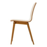 Minimalist beige chair with a smooth, curved backrest and natural wood legs, perfect for modern decor.