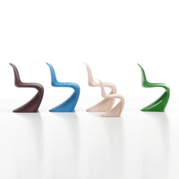 Colorful modern chair set featuring deep brown, vibrant blue, soft pink, and bold green with sleek curved designs.