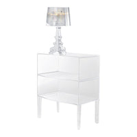 Clear acrylic nightstand with glossy finish and modern design, complemented by a silver striped lamp shade.