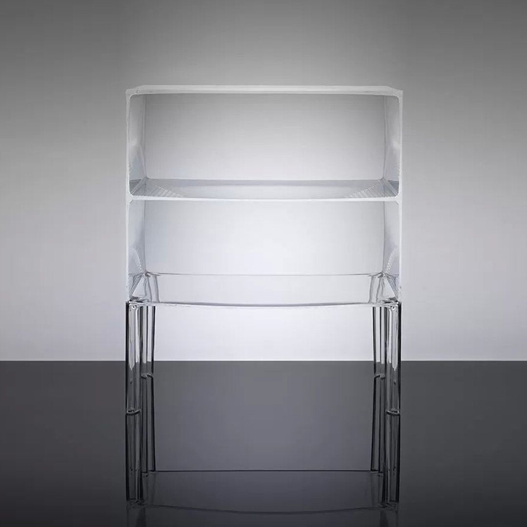 Clear acrylic shelving unit with sleek black legs, showcasing a minimalist design on a gray background.