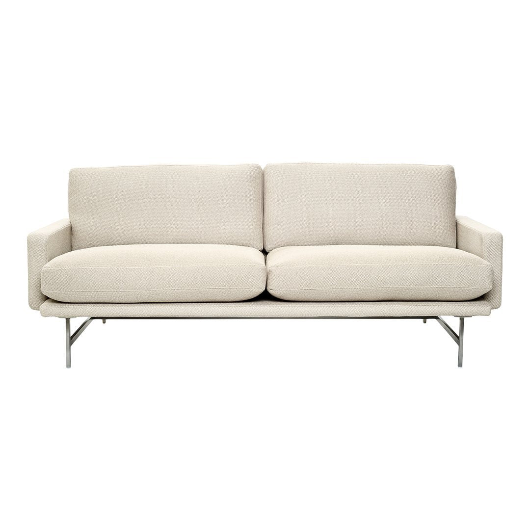 Light beige sofa with a smooth, solid pattern and minimalist silver legs, perfect for modern decor.