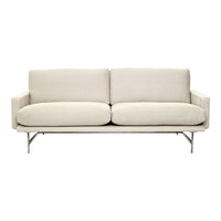Light beige sofa with a smooth, solid pattern and minimalist silver legs, perfect for modern decor.
