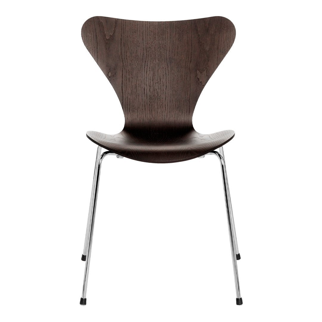 Dark walnut wood chair with smooth curves and sleek chrome legs, featuring a modern minimalist design.