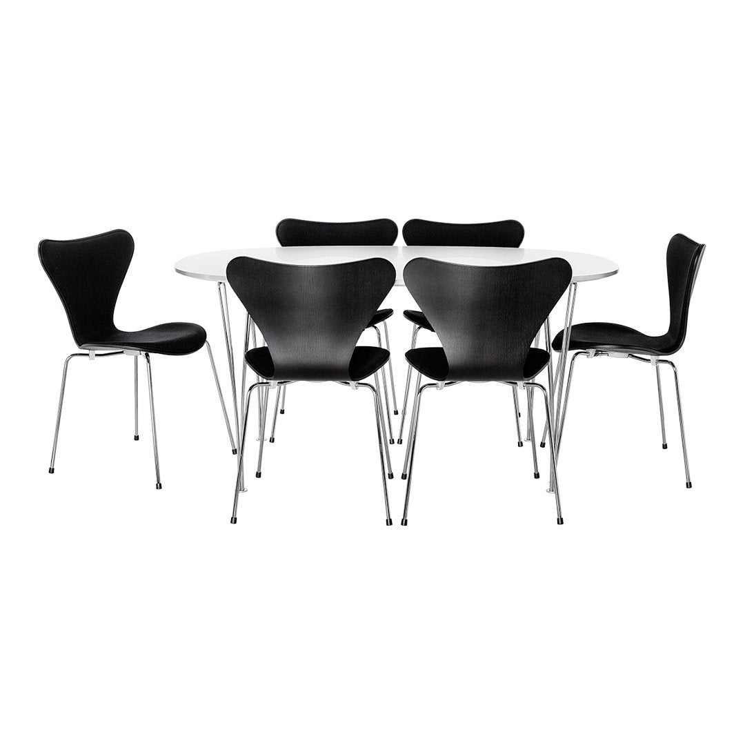 Black chairs with sleek curves surround a modern white tabletop, showcasing a minimalist design.