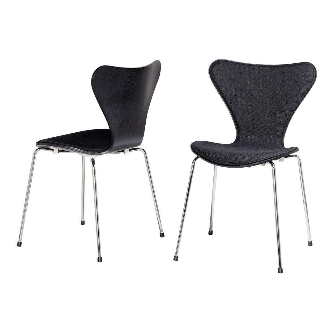 Two modern black chairs with a sleek curved design and chrome legs, featuring a smooth, minimalist finish.