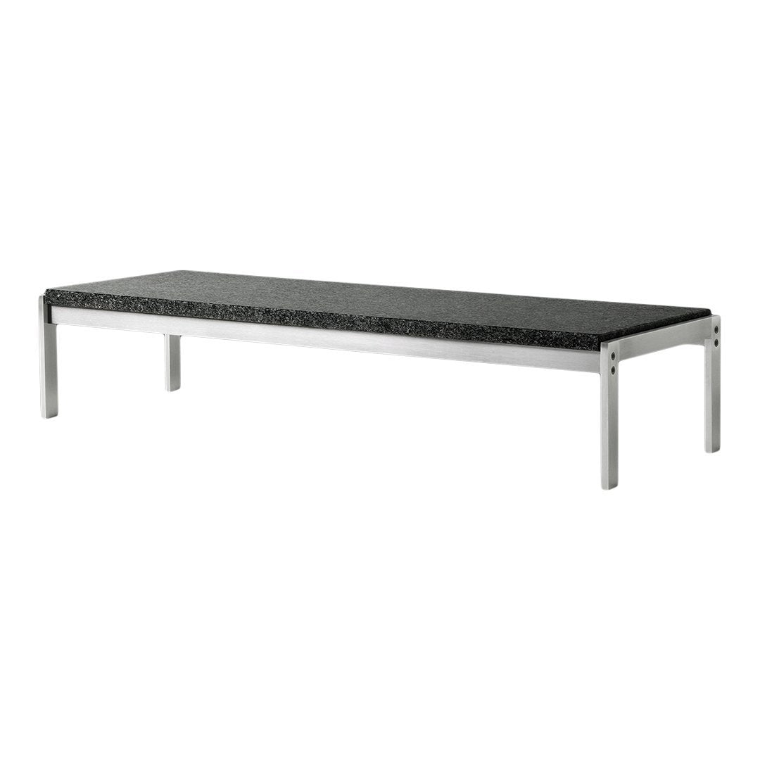 "Modern black stone tabletop with sleek silver legs, featuring a minimalist design."
