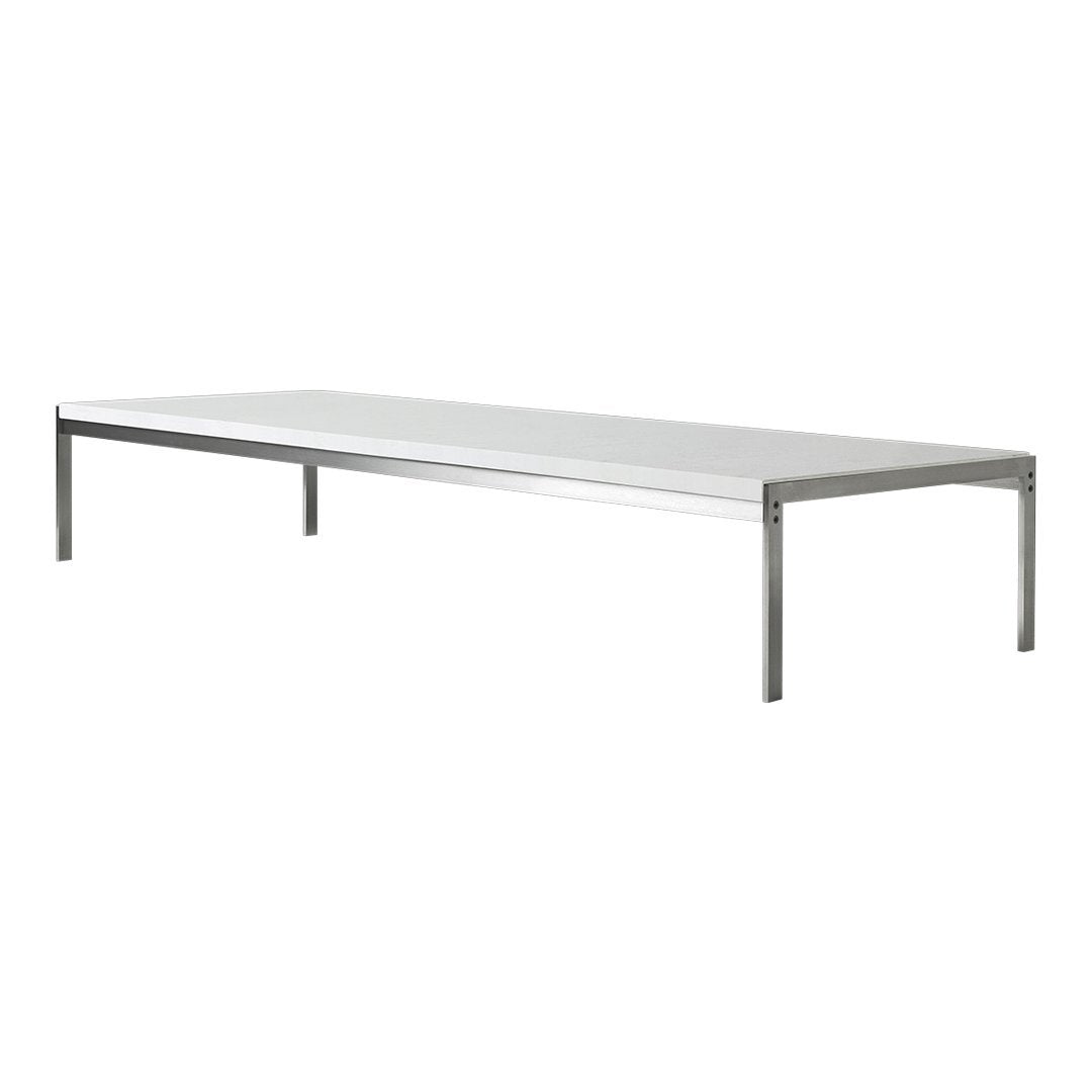 Sleek white tabletop with polished silver legs, perfect for modern spaces. Simple and elegant design.