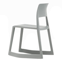 Gray modern chair with a minimalist design and smooth finish, featuring a sleek, angular silhouette.