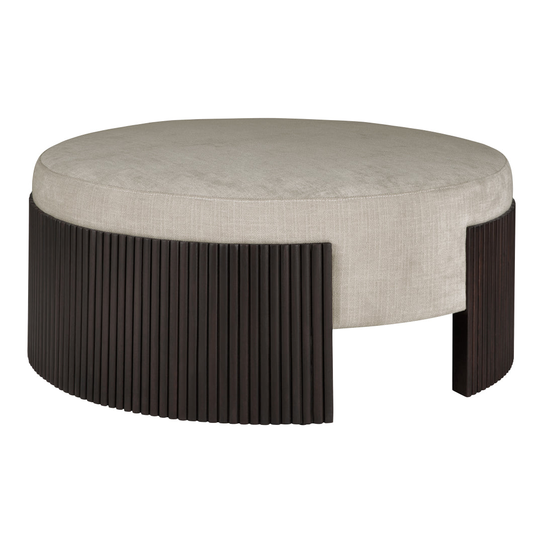 Round ottoman with a soft taupe top and dark wood ribbed base for a modern, stylish contrast.