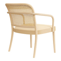 Light wood chair with a natural finish and woven backrest featuring a subtle pattern of circles.