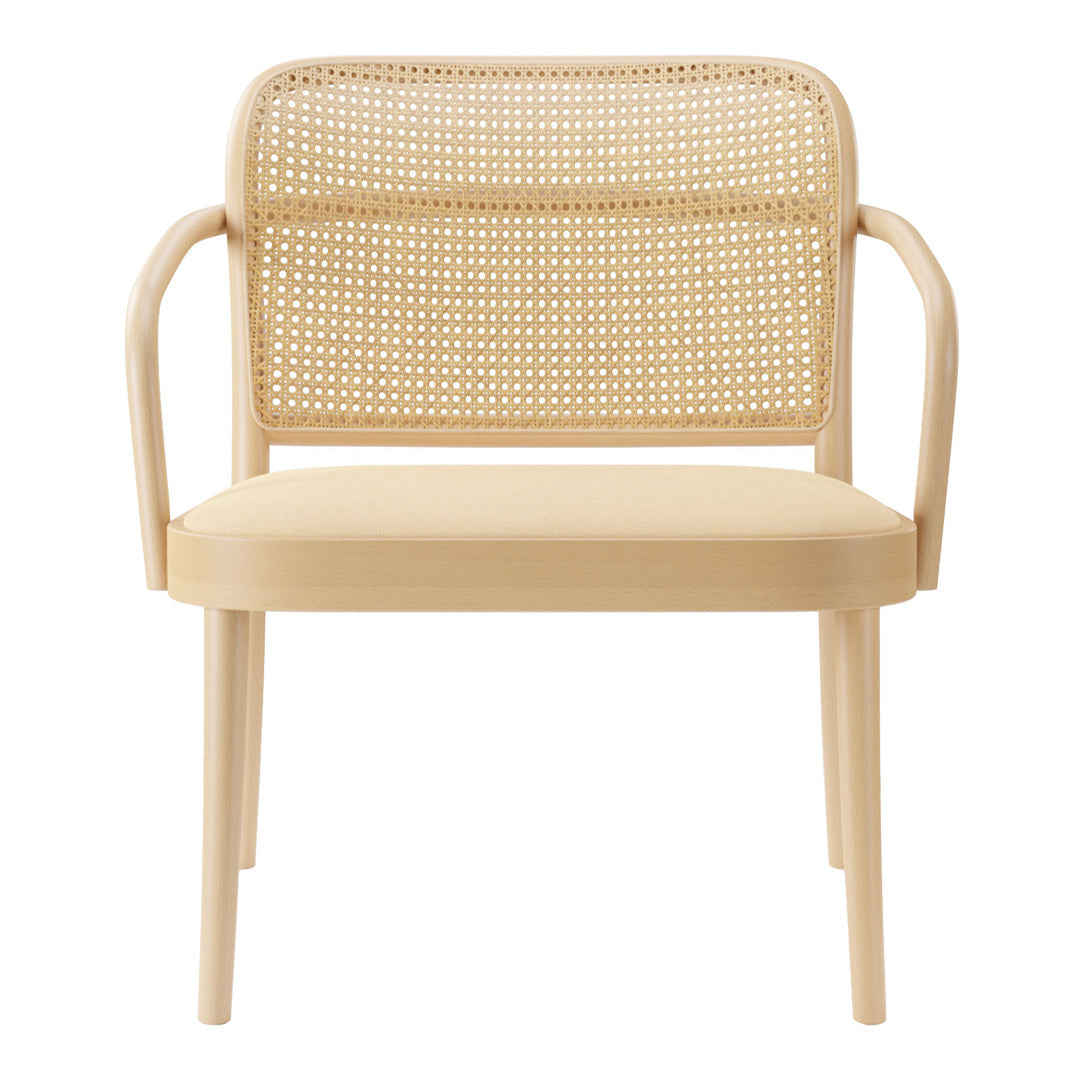 Natural beige armchair with a woven rattan backrest and smooth wooden frame, showcasing minimalist design and texture.