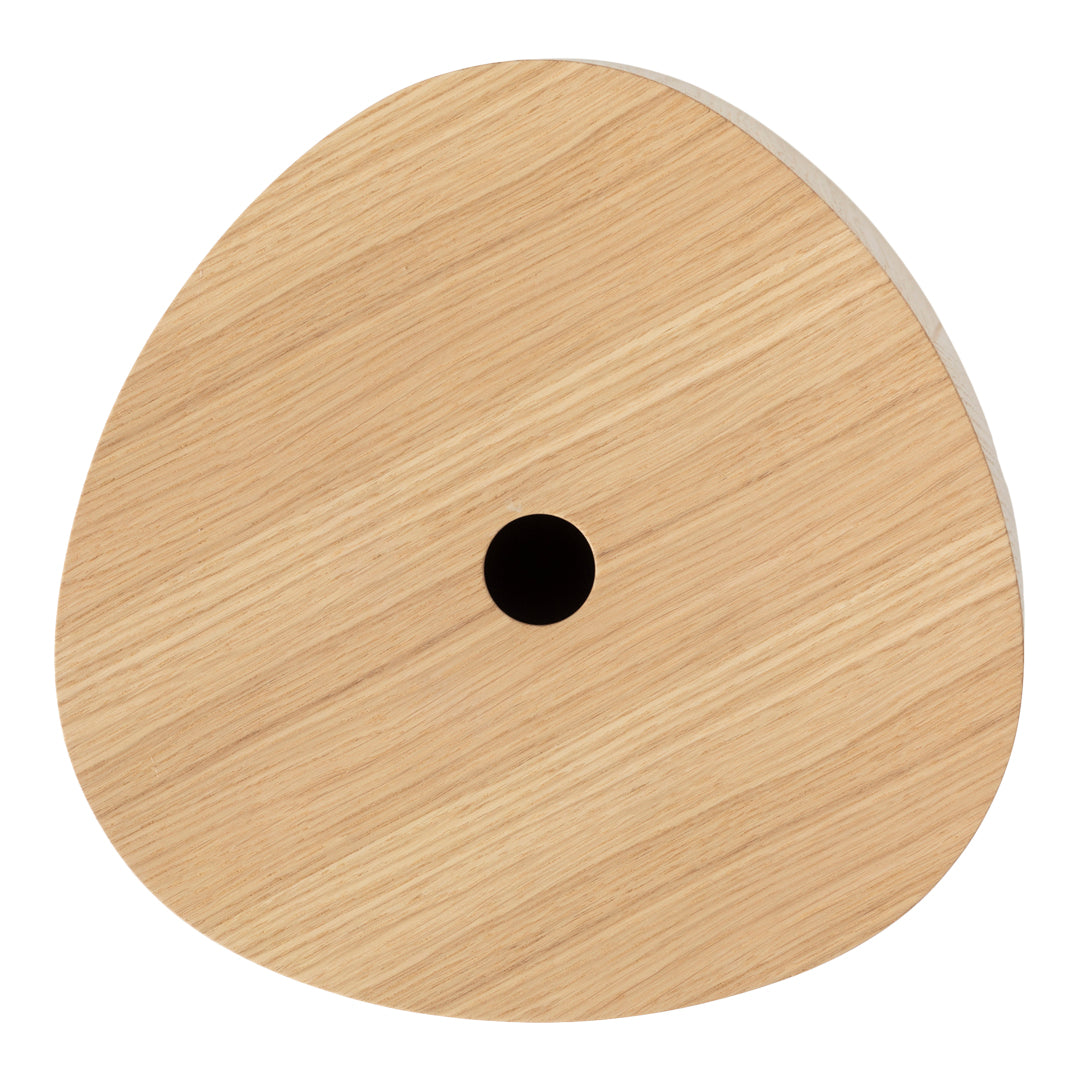 Natural light wood in a unique, rounded shape featuring a subtle grain pattern and a central black hole.