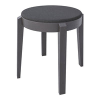 Round stool in solid black with a textured top and sleek gray wooden legs, perfect for modern decor.