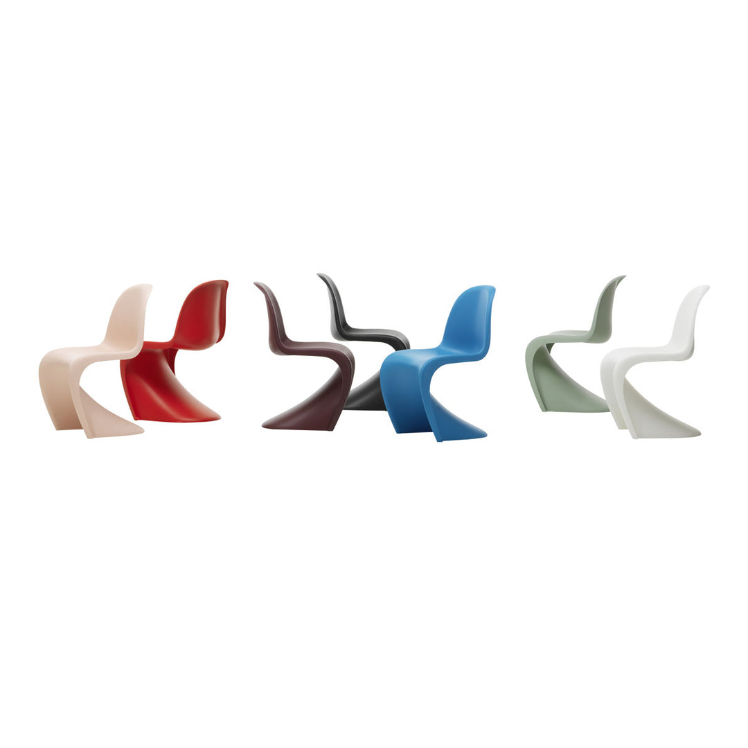 Colorful modern chairs in red, brown, blue, green, and pale pink, featuring sleek, curved designs.