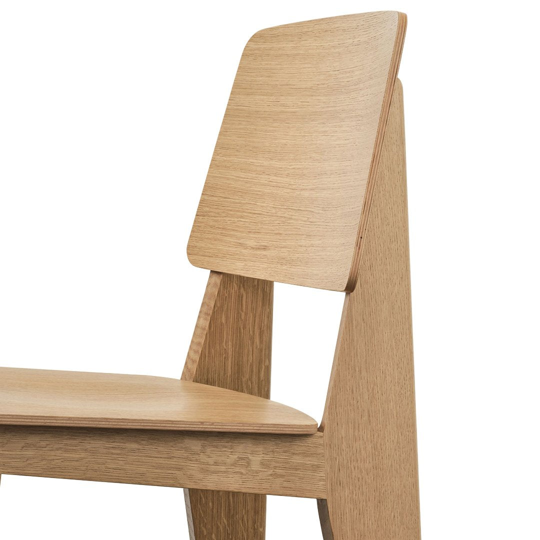 Light oak wood chair with a simple, smooth finish and a minimalist design. Perfect for modern interiors.